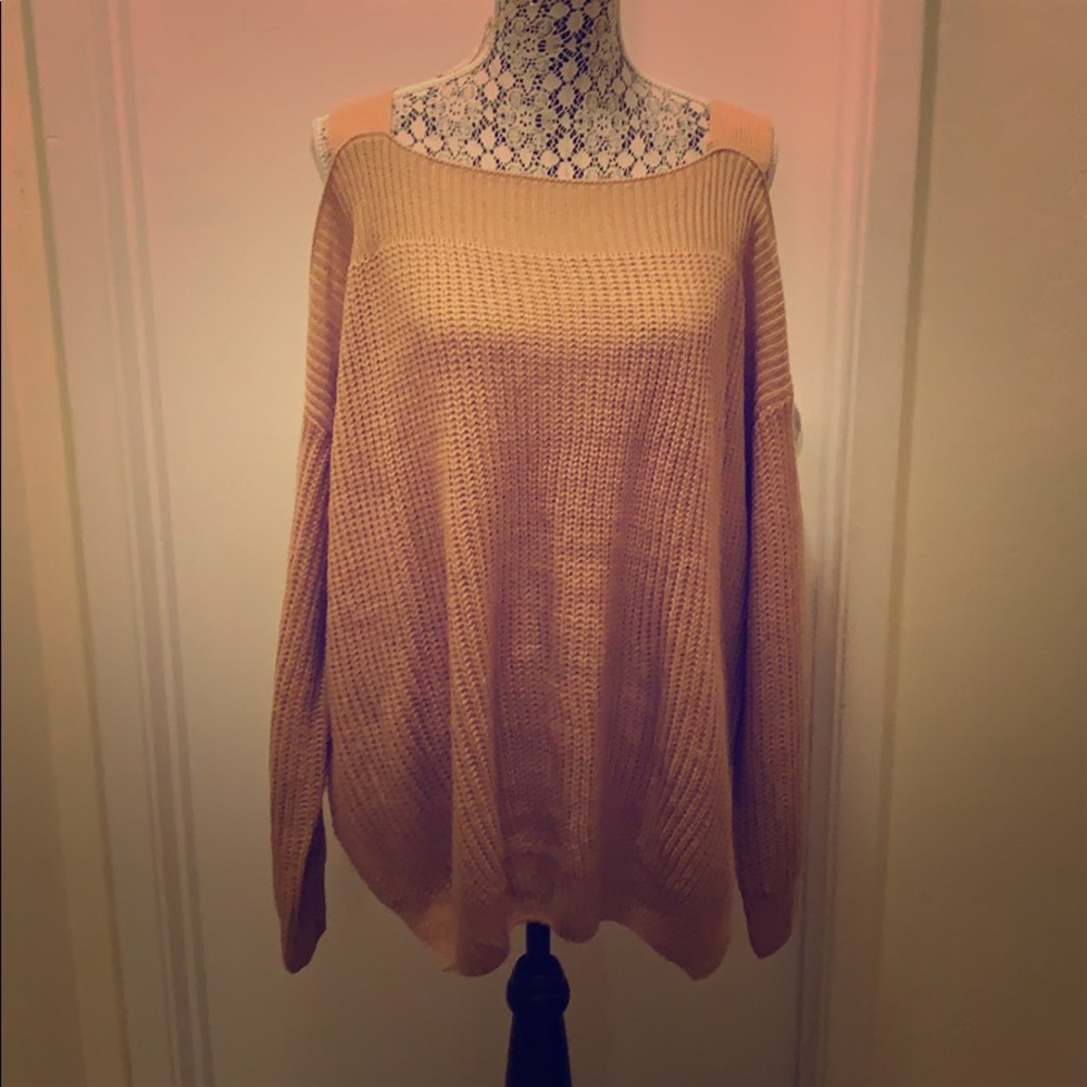 Knitted top with peek a boo shoulder